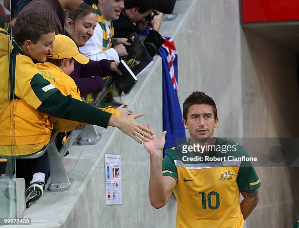 Harry Kewell of Australia acknowledges the fans as he walks out for an Australian Socceroos training session at AAMI Park on May 19, 2010 in...