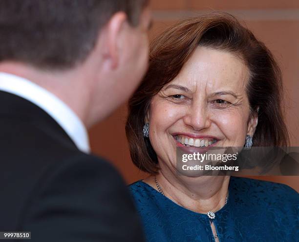 Zeti Akhtar Aziz, governor of Bank Negara Malaysia, speaks to Chris Bowen, Australia's financial services minister, during the signing ceremony...