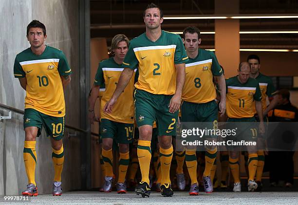 Harry Kewell and Lucas Neill of Australia walk out for an Australian Socceroos training session at AAMI Park on May 19, 2010 in Melbourne, Australia.