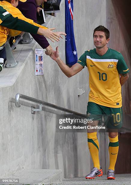 Harry Kewell of Australia acknowledges the fans as he walks out for an Australian Socceroos training session at AAMI Park on May 19, 2010 in...