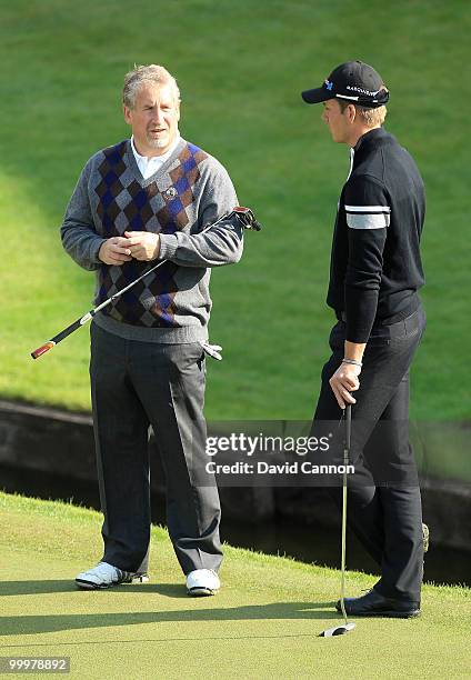 Henrik Stenson of Sweden chats with Simon Kelner during the Pro-Am round prior to the BMW PGA Championship on the West Course at Wentworth on May 19,...