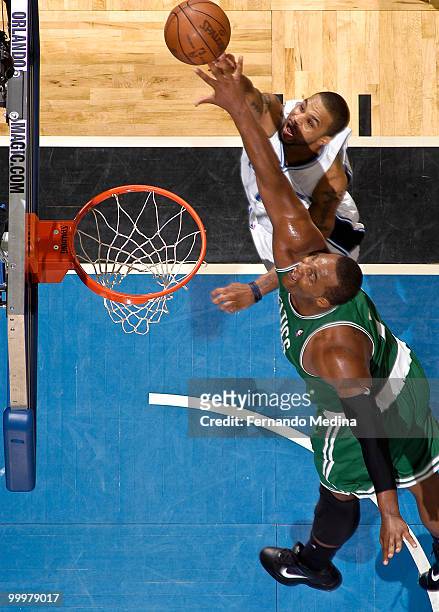 Jameer Nelson of the Orlando Magic shoots against Glen Davis of the Boston Celtics in Game Two of the Eastern Conference Finals during the 2010 NBA...