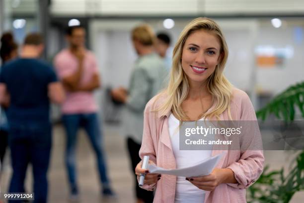 casual business woman at a creative office - andresr stock pictures, royalty-free photos & images