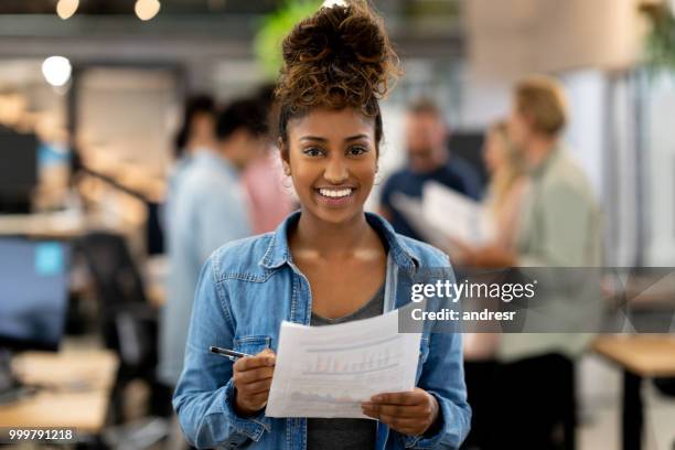 happy woman working at a creative office - andresr stock pictures, royalty-free photos & images