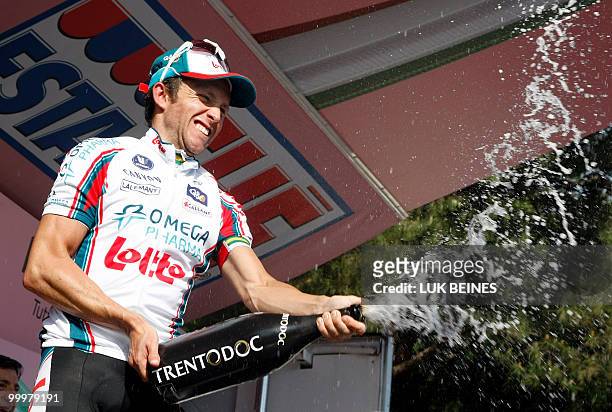 Australia's Matthew Lloyd celebrates on the podium after winning the sixth stage of the 93rd Giro d'Italia going from Fidenza to Marina di Carrara on...