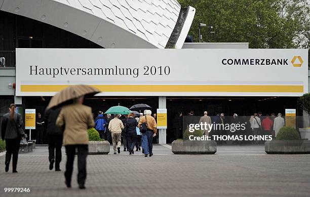 Shareholders arrive for the annual general meeting of Germany's second biggest bank Commerzbank on May 19, 2010 in Frankfurt/M., western Germany. AFP...