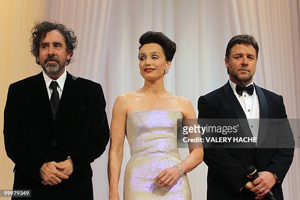 Director and president of the jury Tim Burton , British actress Kristin Scott Thomas and Australian actor Russell Crowe pose during the opening...