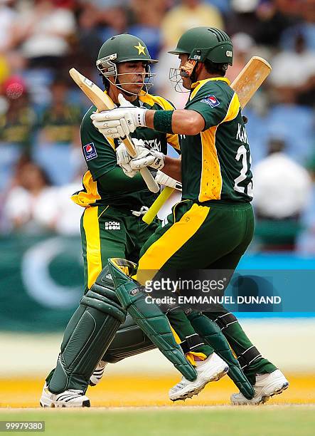 Pakistani batsmen Salaman Butt and Kamran Akmal nearly collide as they score a run during the ICC World Twenty20 second semifinal match between...