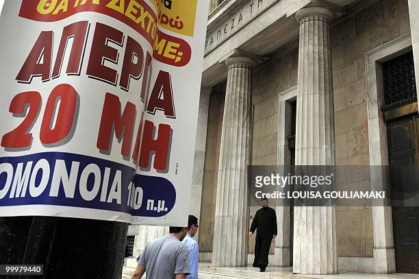 Poster calling for a general strike on May 20 is attached to a lamp post by the headquarters of the Bank of Greece in central Athens on May 19, 2010....