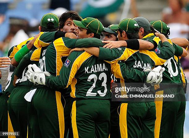 Pakistani bowler Mohammad Aamer celebrates with teammates after taking the wicket of Australian batsman David Warner during the ICC World Twenty20...