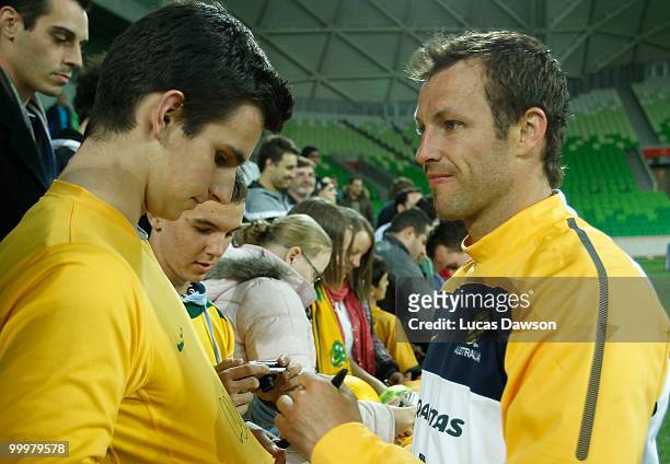 Lucas Neill of the Socceroos signs autographs after an Australian Socceroos training session at AAMI Park on May 19, 2010 in Melbourne, Australia.