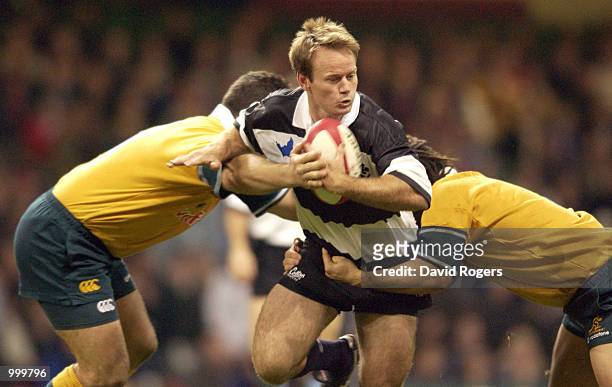 Pat Howard of the Barbarians breaks through the Australian defence during the Scottish Amicable Challenge match between the Barbarians and Australia...