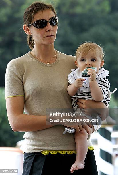 French actress Clotilde Courau, wife of Italian Emanuele Filiberto Di Savoia, looks away with her daugther Victoria as they arrive at Venice Lido, 31...
