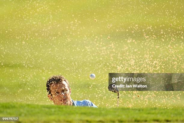 Austin Healey hits from a bunker during the Pro-Am round prior to the BMW PGA Championship on the West Course at Wentworth on May 19, 2010 in...