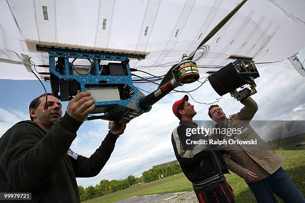 Students of the distance university of Hagen work on their air robot zeppelin during a trial at the German army base on May 18, 2010 in Hammelburg,...