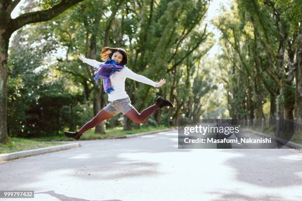 portrait of a healthy asian woman in the park - masafumi nakanishi imagens e fotografias de stock