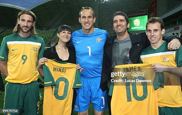 Josh Kennedy,Mark Schwarzer and Luke Wilkshire of the Socceroos pose with Rogue Traders members James Ash and Mindi Jackson before an Australian...