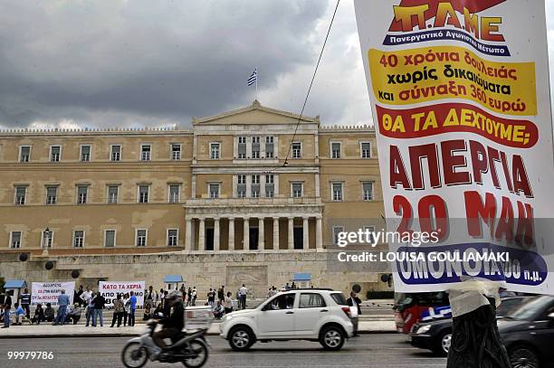 Poster calling for a general strike set for May 20th hangs in front of the Greek parliament in central Athens on May 19, 2010. Greece insisted it had...