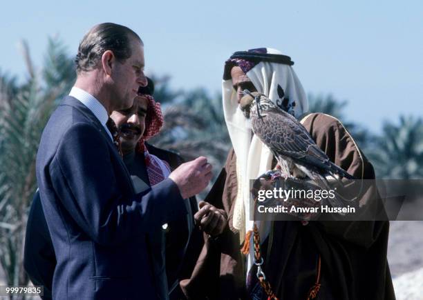 Prince Philip, Duke of Edinburgh looks at a hawk during a visit to Bahrain in February 1979 in Manama, Bahrain.