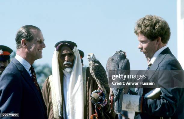 Prince Philip, Duke of Edinburgh looks at a hawk during a visit to Bahrain in February 1979 in Manama, Bahrain.