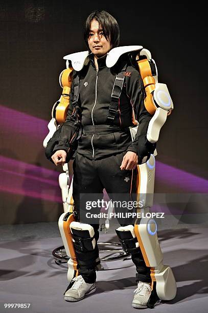 Man demonstrates the robot suit HAL - the world first cyborg-type robot that expands, support and improves the physical capability of its user - at...