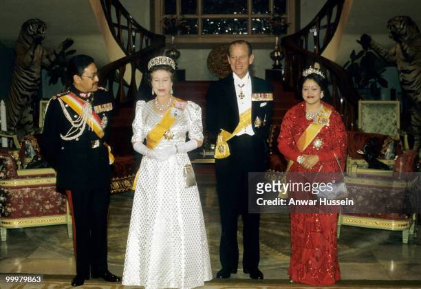 Queen Elizabeth ll and Prince Philip, Duke of Edinburgh pose with King Birendra and Queen Aishwarya during a visit to Nepal on February 19,1986 in...
