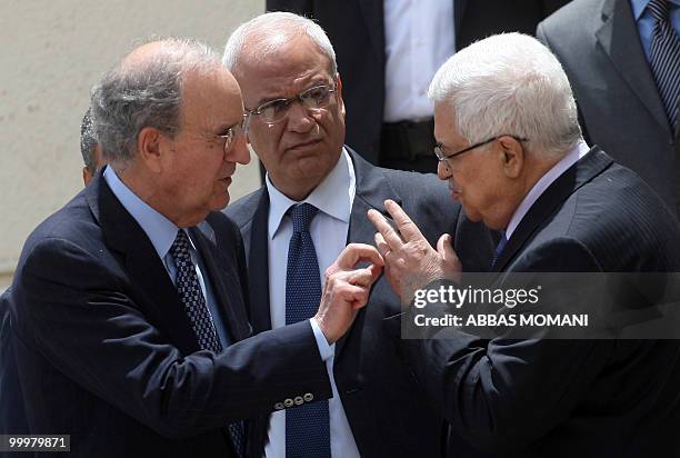 Palestinian president Mahmud Abbas talks with US Middle East envoy George Mitchell , next to Palestinian chief negotiator Saeb Erakat, upon his...