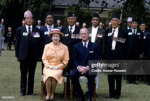 Queen Elizabeth ll and Prince Philip, Duke of Edinburgh pose with Gurkhas during an official visit to Nepal on February 18, 1986 in Kathmandu, Nepal.