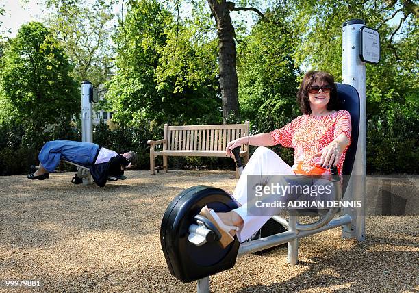 Ray Dyer uses an exercise machine while Frances Blois does sit-ups during the official opening of the first pensioners' playground in Hyde Park in...