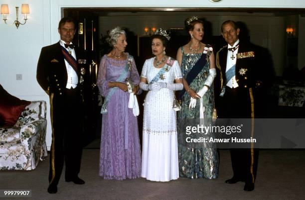 Queen Elizabeth ll and Prince Philip, Duke of Edinburgh entertain the Danish Royal Family on the Royal Yacht Britannia during a visit to Denmark in...