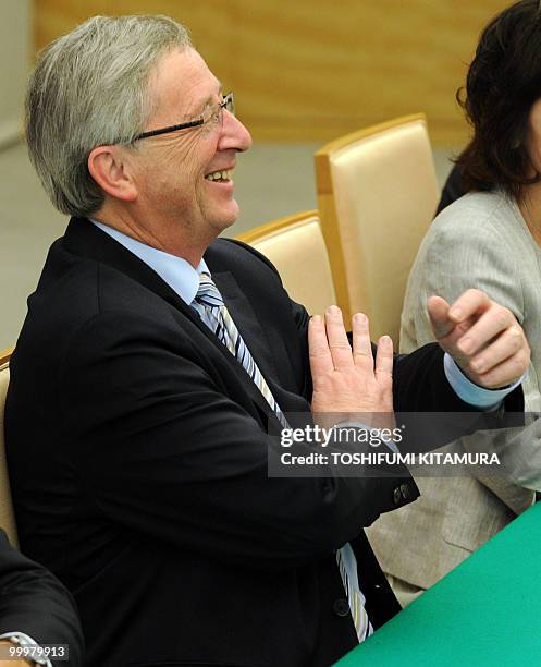 Luxembourg Prime Minister Jean-Claude Juncker laughs during his meeting with Japanese Prime Minister Yukio Hatoyama at Hatoyama's official residence...