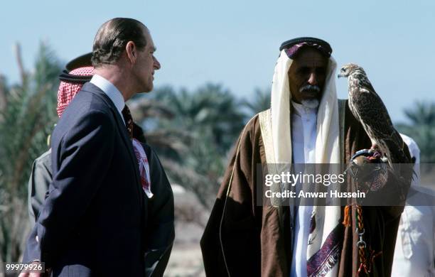 Prince Philip, Duke of Edinburgh looks at a hawk during a visit to Bahrain in February 1979 in Manama, Bahrain.