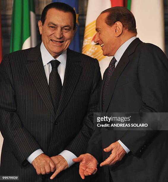Italian Prime Minister Silvio Berlusconi and his Egyptian counterpart Hosni Mubarak smile during a family photo of an Egyptian-Italian summit on May...