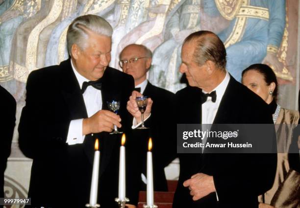 Prince Philip, Duke of Edinburgh and President Boris Yeltsin of Russia toast one another during a State Banquet at the Granovitaya Palace during an...