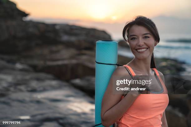 portrait of a beautiful woman doing yoga outdoors - andresr stock pictures, royalty-free photos & images