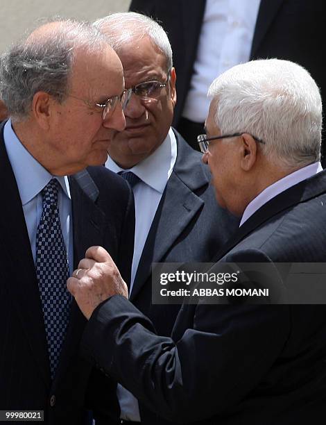 Middle East envoy George Mitchell talks with Palestinian president Mahmud Abbas and Palestinian Chief Negotiator Saeb Erakat upon arrival for...