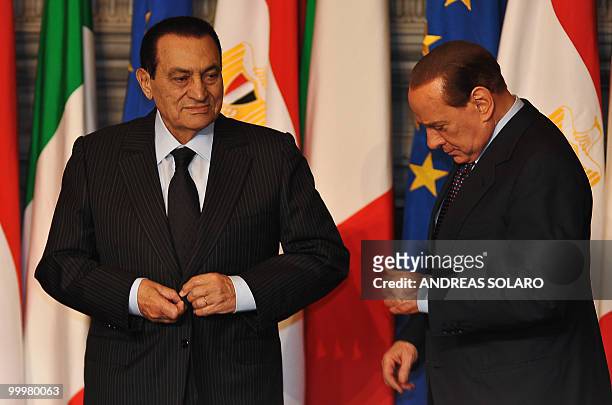 Italian Prime Minister Silvio Berlusconi and his Egyptian counterpart Hosni Mubarak get ready for a family photo of an Egyptian-Italian summit on May...