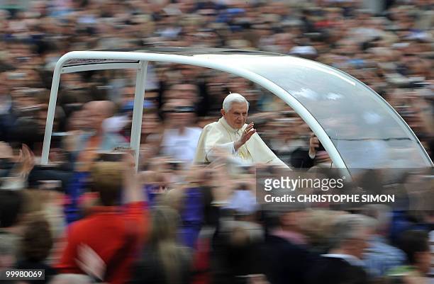 Pope Benedict XVI waves as he arrives for his weekly general audience at St peter's square on May 19, 2010 at The Vatican. AFP PHOTO / CHRISTOPHE...