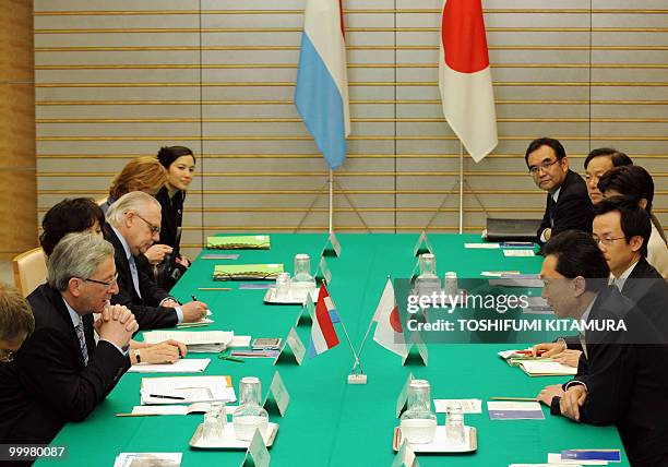 Japanese Prime Minister Yukio Hatoyama talks with Luxembourg Prime Minister Jean-Claude Juncker during meeting at Hatoyama's official residence in...