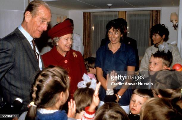 Queen Elizabeth ll and Prince Philip, Duke of Edinburgh visit a school during an official visit to Russia in October 1994 in Moscow, Russia.