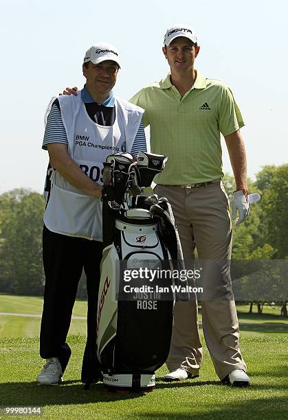 Justin Rose of England poses with a competition winner who caddied for him during the Pro-Am round prior to the BMW PGA Championship on the West...