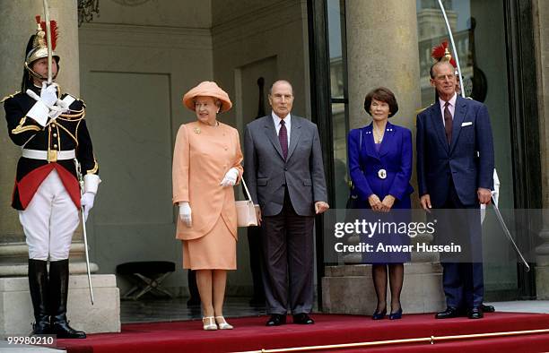 Queen Elizabeth ll and Prince Philip, Duke of Edinburgh pose with President and Madame Mitterand on June 9, 1992 in Paris, France.