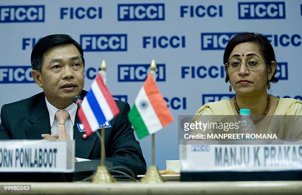 Thailand Deputy Minister of Commerce Alongkorn Ponlabhoot addresses a business meeting as Assistant Secretary General Federation of Indian Chambers...