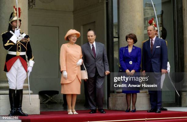 Queen Elizabeth ll and Prince Philip, Duke of Edinburgh pose with President and Madame Mitterand on June 9, 1992 in Paris, France.