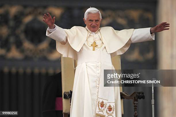 Pope Benedict XVI waves to faithful during his weekly general audience at St Peter's square on May 19, 2010 at The Vatican. AFP PHOTO / CHRISTOPHE...