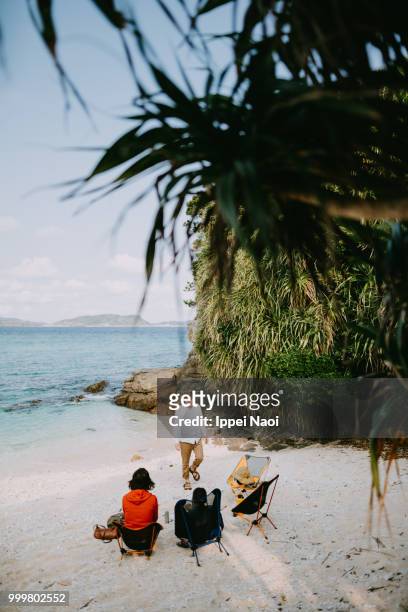 family camping on white sand tropical beach, okinawa, japan - okinawa islands stock pictures, royalty-free photos & images