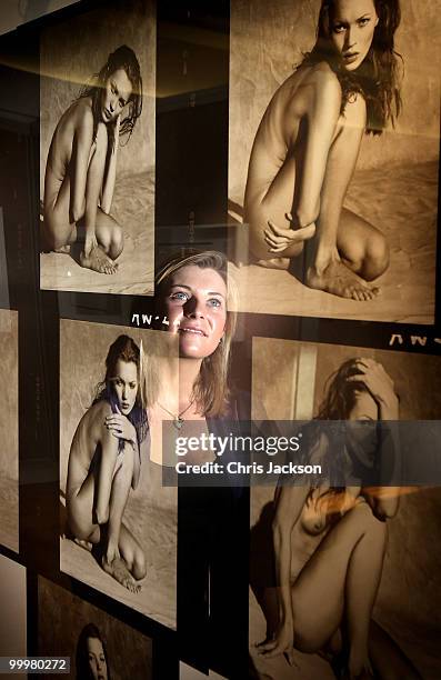 Christies employee looks at a contact sheet with 14 images of Kate Moss at Christie's South Kensington on May 19, 2010 in London, England. The...
