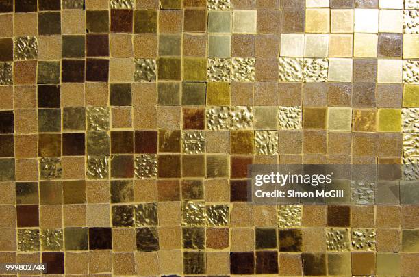 shiny gold tile mosaic on an exterior wall - australian capital territory stock pictures, royalty-free photos & images