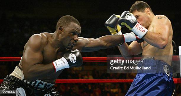 Hasim Rahman and Kali Meehan trade punches during their 10 round heavyweight bout at Madison Square Garden in New York City on November 13, 2004....