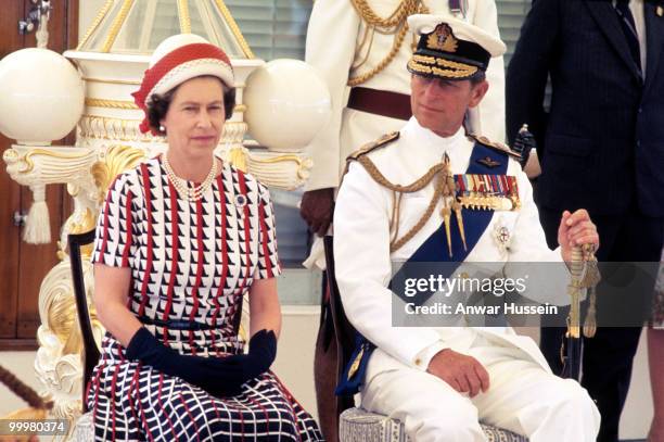 Queen Elizabeth ll and Prince Philip, Duke of Edinburgh receive and are entertained by Fijian folk and traditional dancers on board the Royal Yacht...